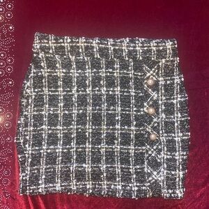 Tweed skirt with pearl button detail and zipper closure